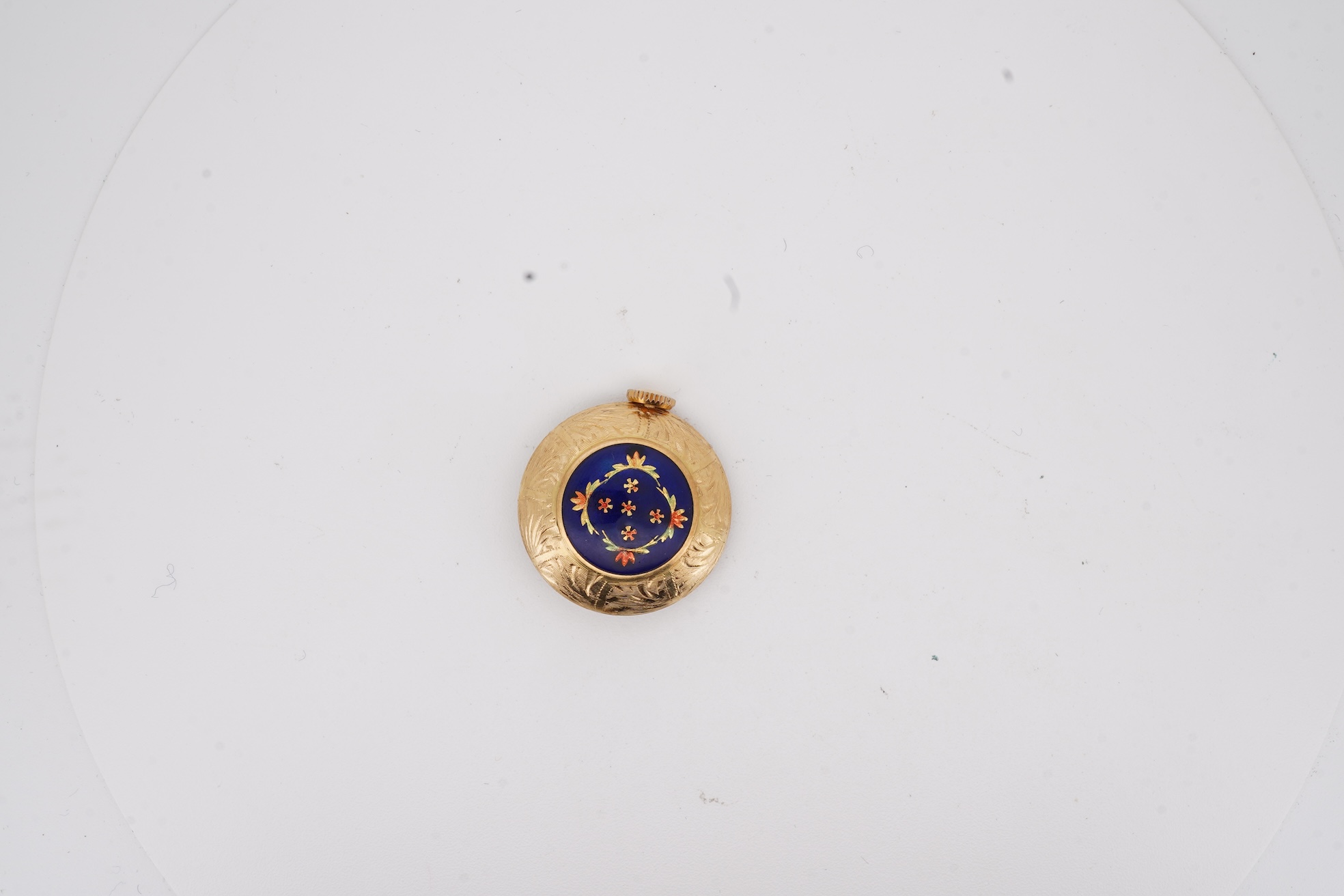 A mid 20th century Italian 18k and enamel fob watch, dial a.f., suspended from and Italian 18k and blue enamelled ribbon bow brooch, brooch width 30mm.